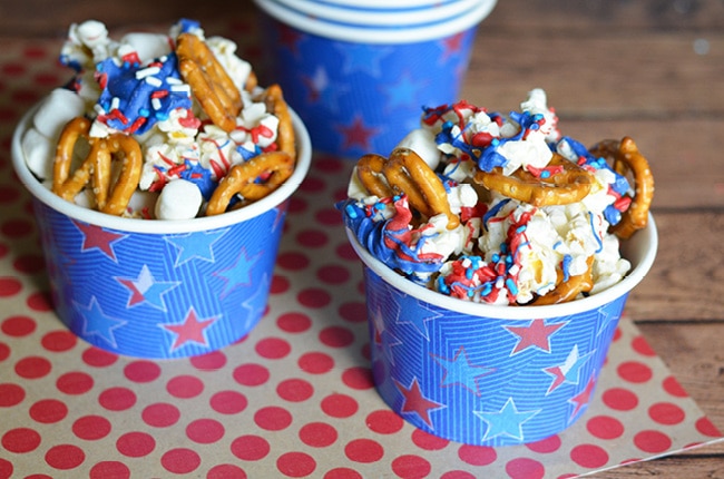 With a handful of simple products, you can make this red, white and blue patriotic snack mix for your next outing and be the hit of the party!