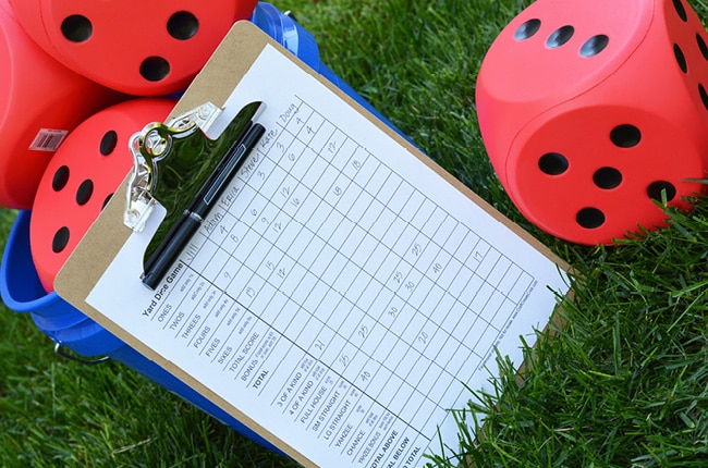 Outdoor lawn games are a must for summer! Our DIY Yard Dice Game will be a hit at your next gathering!