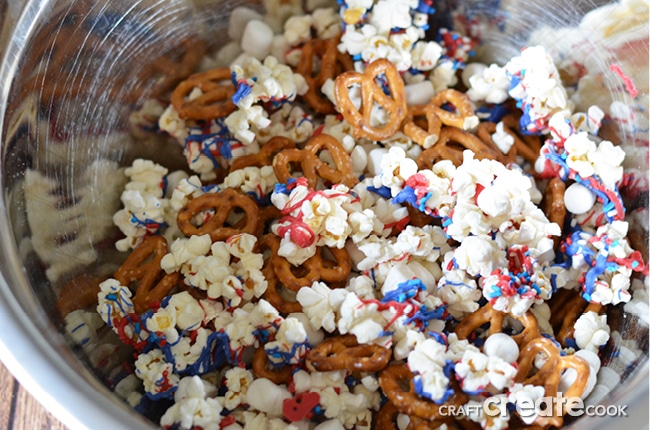 With a handful of simple products, you can make this red, white and blue patriotic snack mix for your next outing and be the hit of the party! 