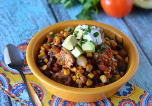 Our Chicken Mexican Stew is a hearty slow cooker meal that's easy to make and is bursting with flavor!