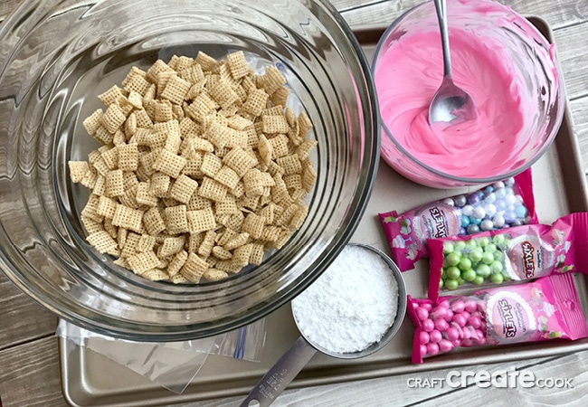 Sing, dance and hug while you make and eat this Trolls puppy chow!