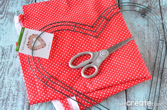 Cue up your favorite Netflix show and make this easy Valentine Fabric Wreath!