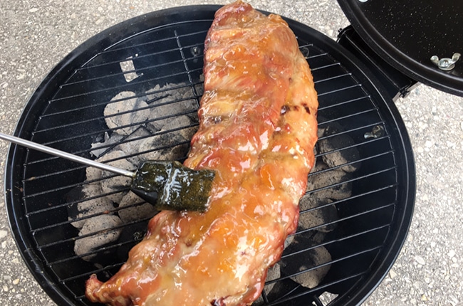 These Extra Tender Peach Ginger Charcoal Grilled Ribs will make your mouth water just by looking them.