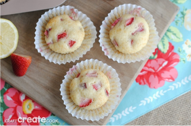 Strawberry Lemon Muffins combine fresh strawberries and lemon zest for a delicious grab and go breakfast or a quick snack!