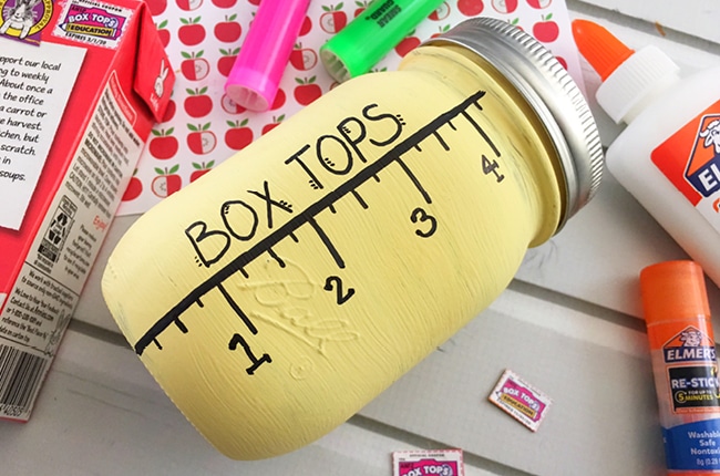 Our Mason Jar Box Top Collection Jar is a perfect DIY way to collect box tops to save for your child's school.