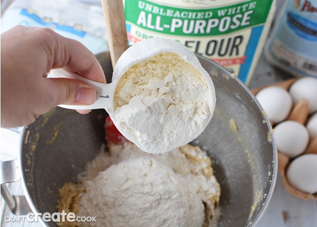 Mixing flour into the cookie dough