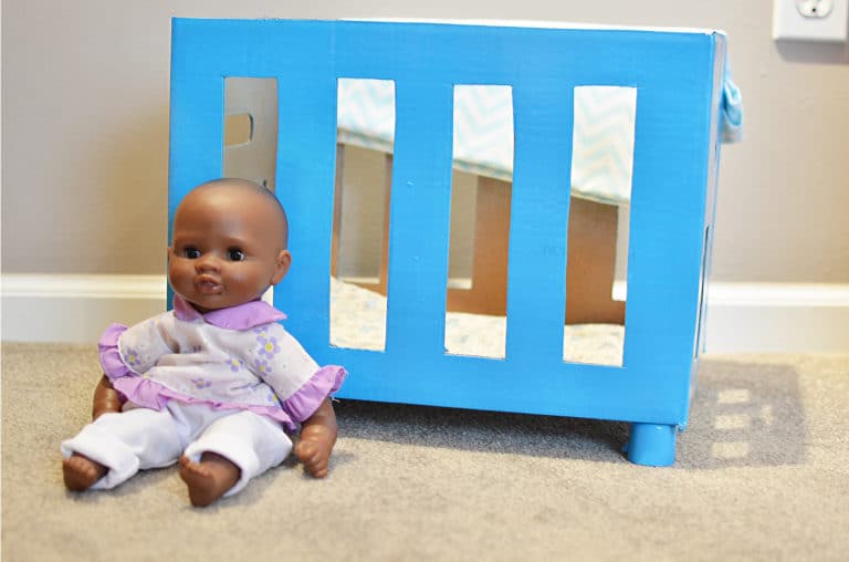 Reuse a box to create a DIY baby doll crib for hours of fun!