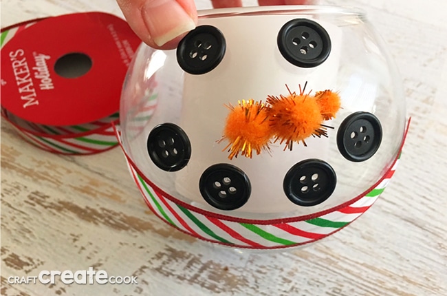 This DIY Winter Snowman Candle Craft will not only look festive, it will have your house smelly great in no time.a