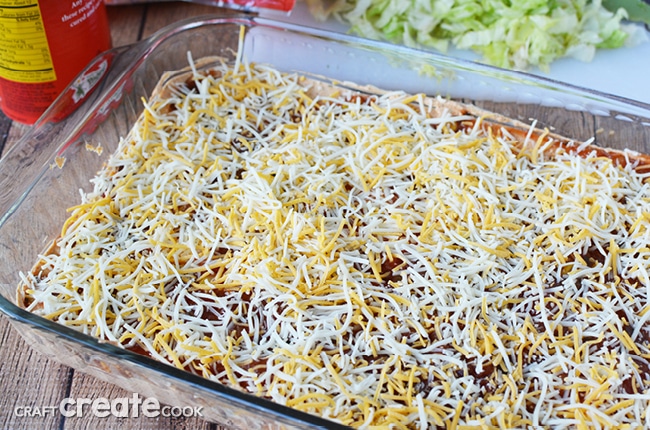 This taco dip recipe is best made the day before and will easily please a crowd!