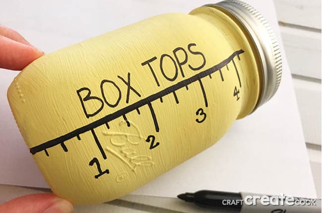 Our Mason Jar Box Top Collection Jar is a perfect DIY way to collect box tops to save for your child's school.