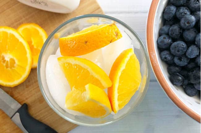 Learn How to Become a Morning Person with a glass of fruit infused water and 5 simple steps.