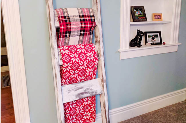 Learn how to Make a DIY Blanket Ladder for under $15 and your friends will think you bought it.