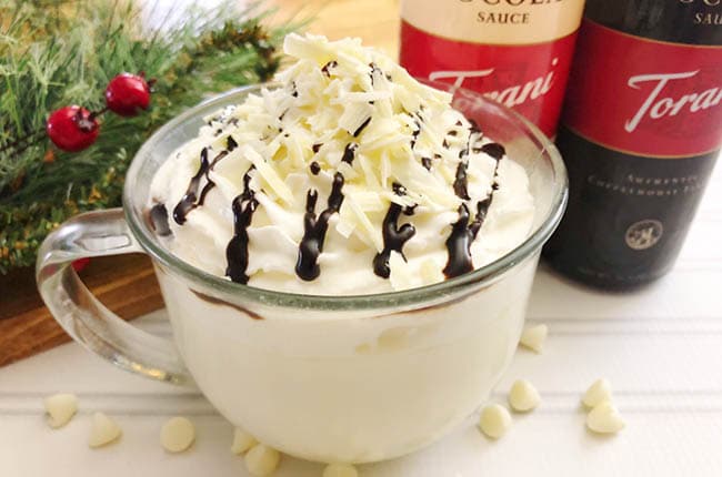 This Slow Cooker White Hot Chocolate tastes like a sweet white chocolate bar and is the best way to warm you up on a chilly day.
