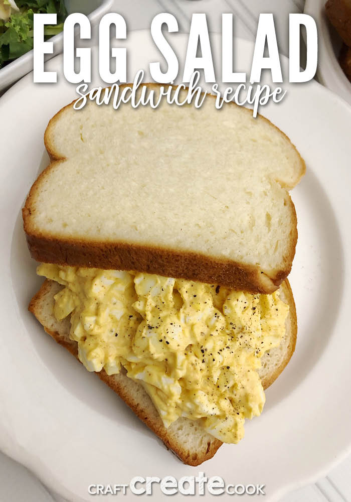 Finished egg salad sandwich placed in a white plate.