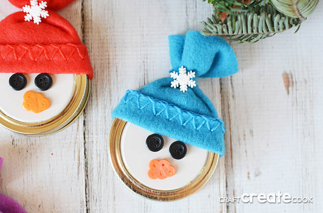 This easy to make Mason Jar Lid Snowman Ornament is so cute you'll want to make at least a dozen!