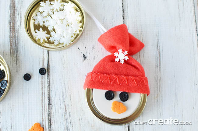 This easy to make Mason Jar Lid Snowman Ornament is so cute you'll want to make at least a dozen!