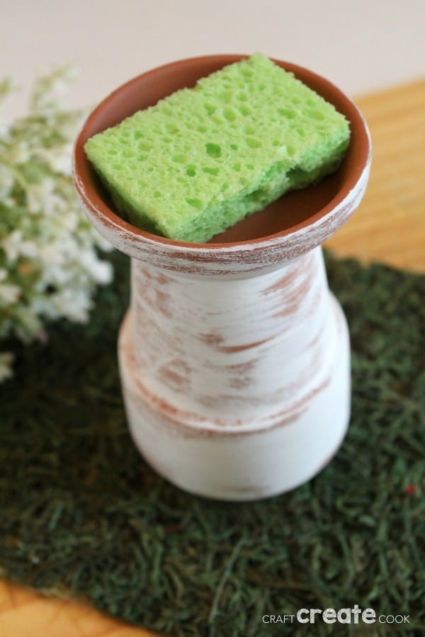 White butterfly planter on green fabric