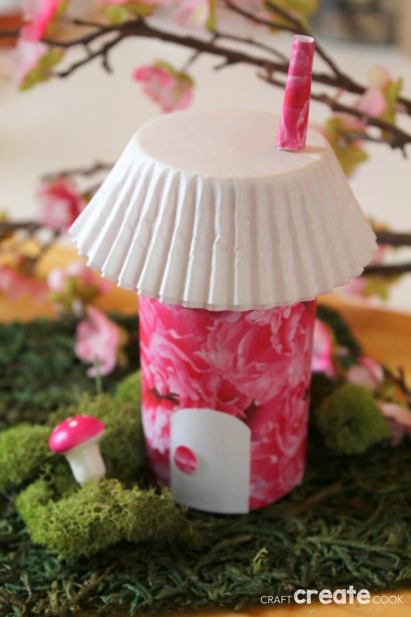 Fairy house with pink exterior and white cupcake liner roof