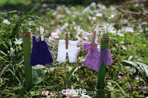 Fairy garden clotheline with purple clothing