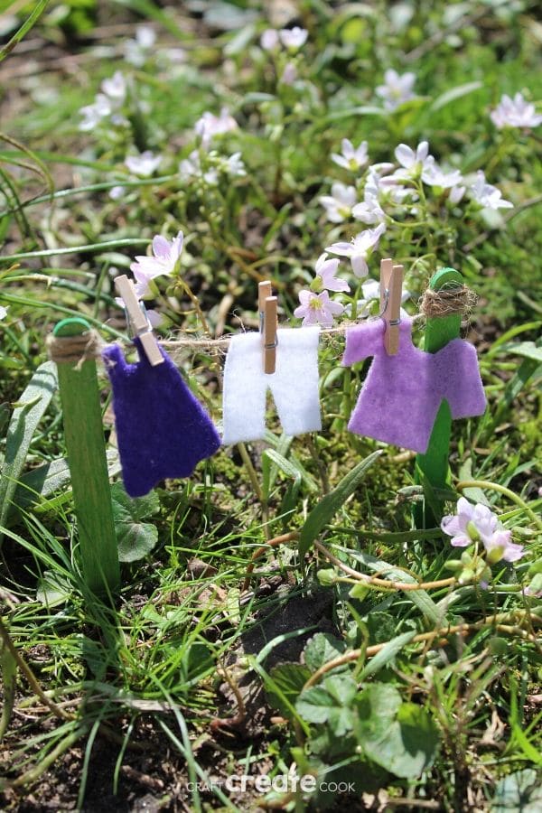 Fairy garden clotheline with purple clothing