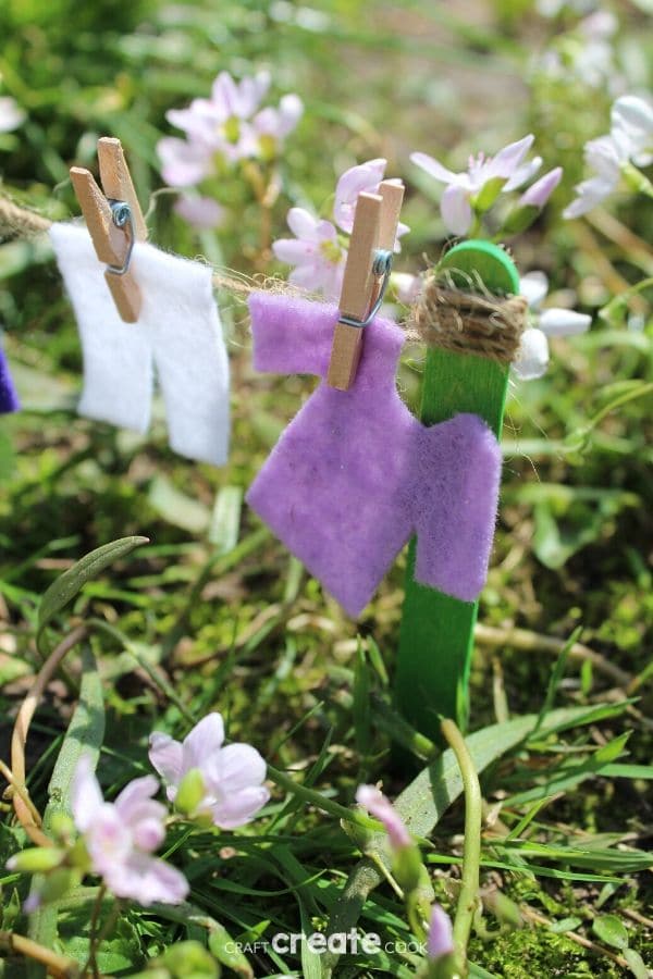 Fairy garden clotheline with purple clothing