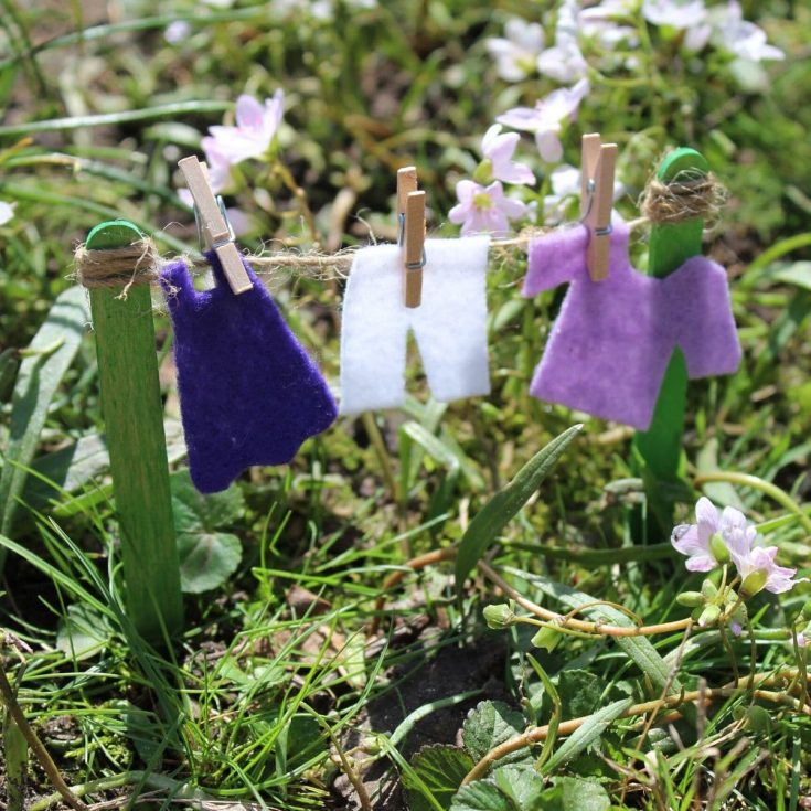 Fairy garden clotheline with purple clothing