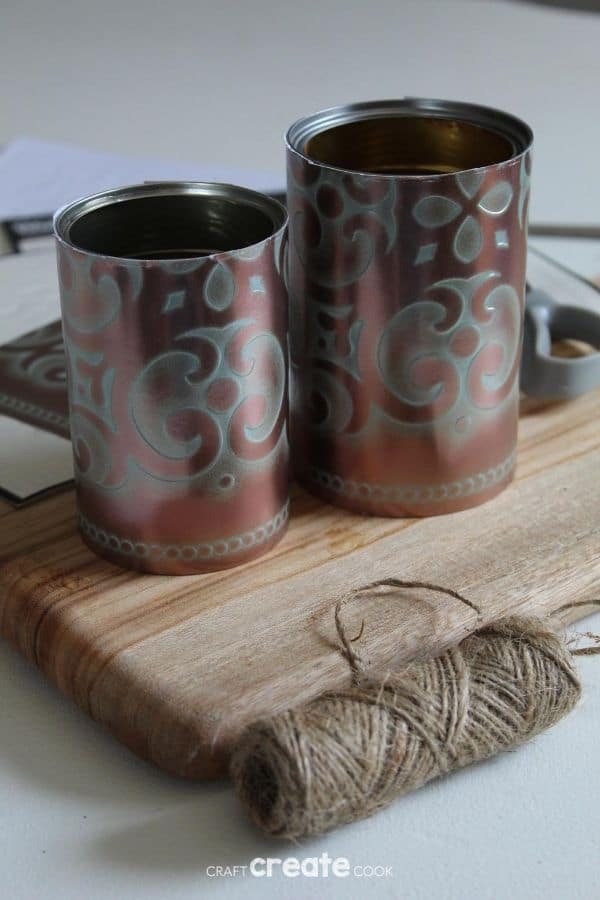 Covered tin cans on cutting board