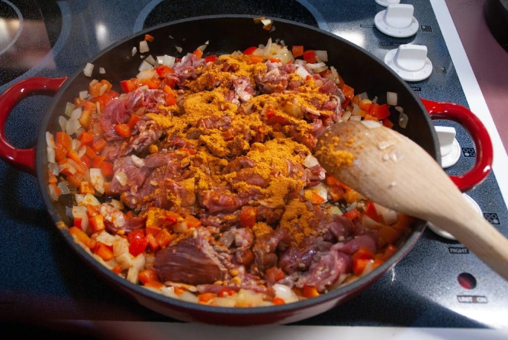 Adding seasoning to skillet