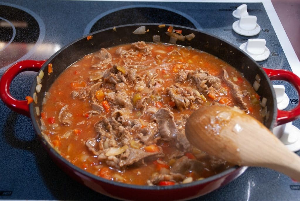 Tomato sauce with beef in skillet