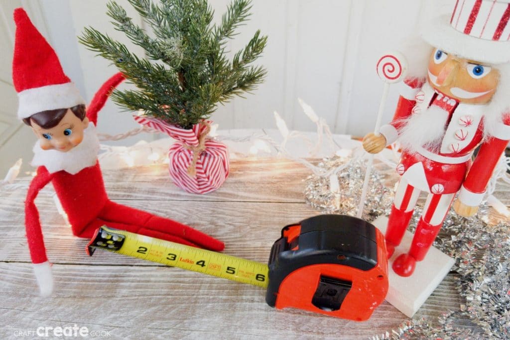 Elf on the shelf with tape measure