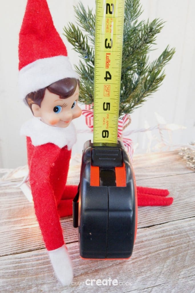 Elf on the shelf with tape measure