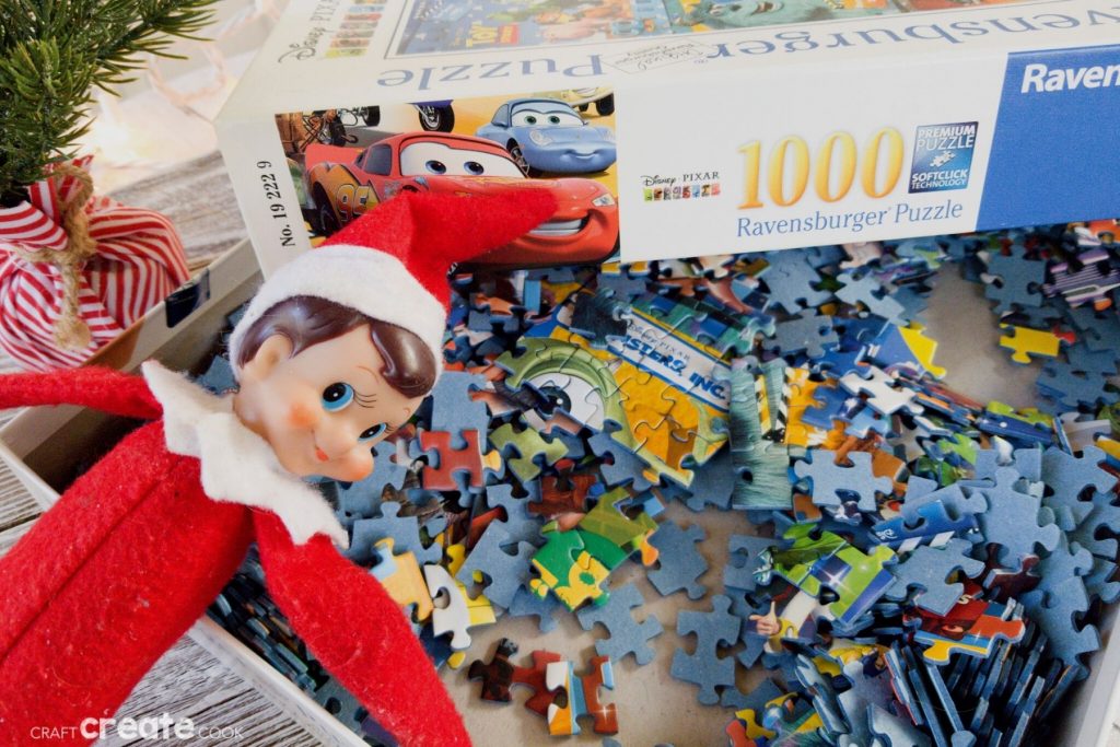 Elf on the Shelf laying in puzzle pieces