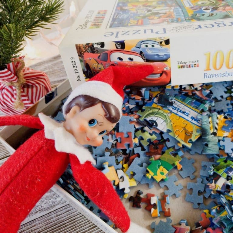 Elf on the Shelf laying in puzzle pieces