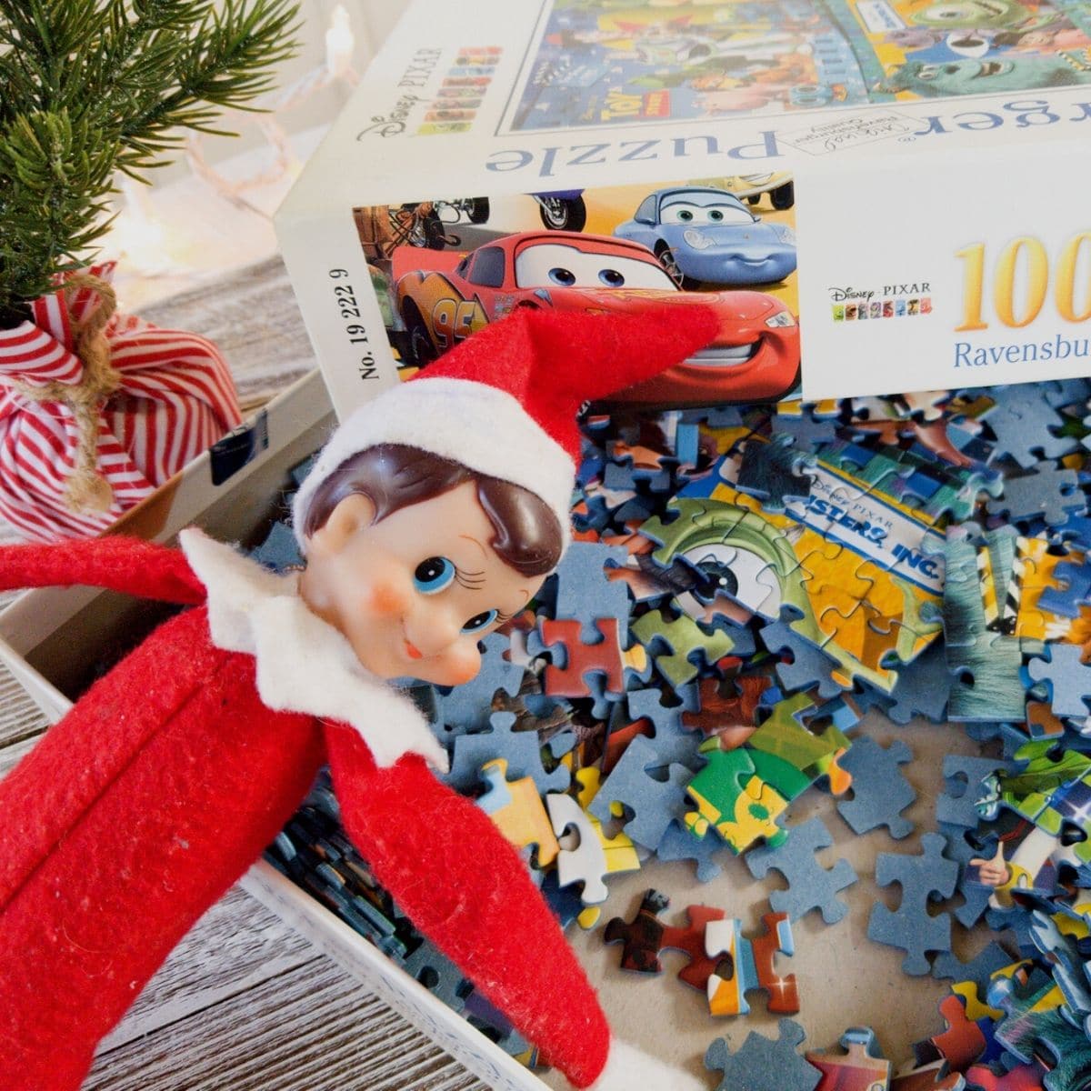 Elf on the Shelf laying in puzzle pieces