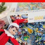 Elf on the Shelf laying in puzzle pieces