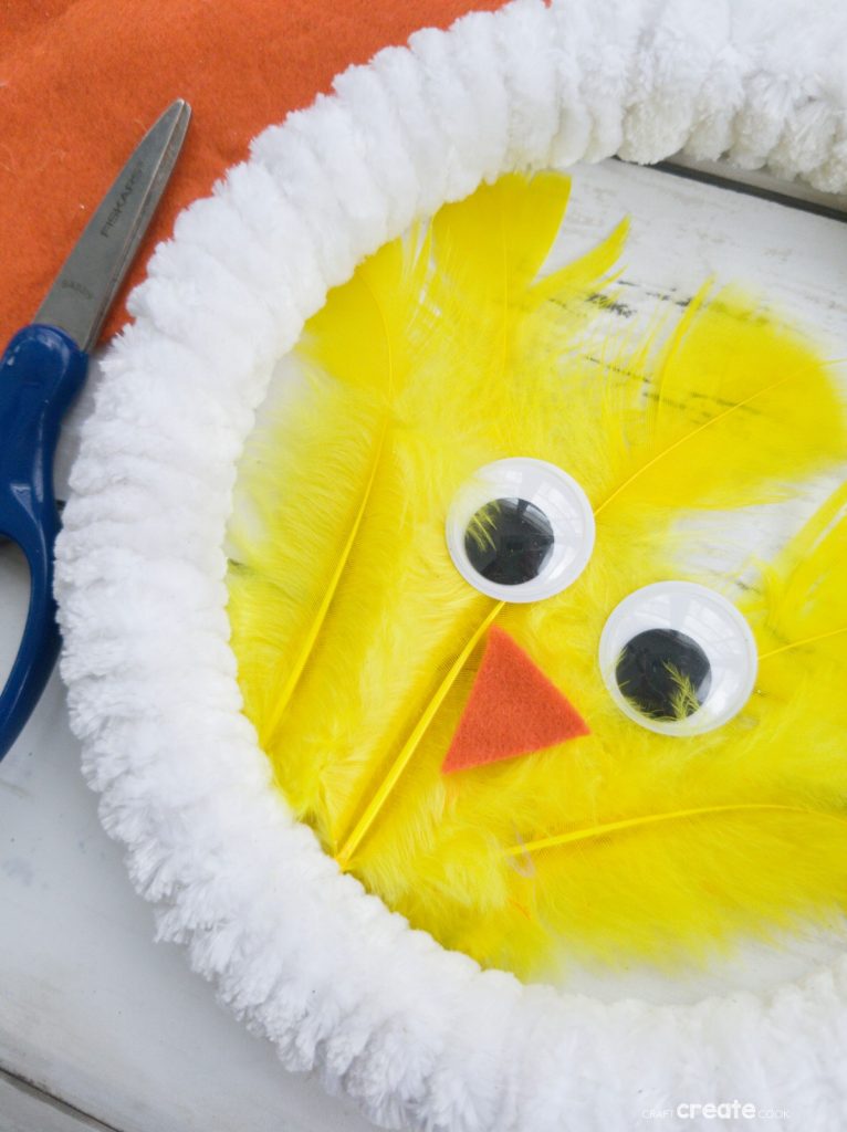 White wreath with yellow feather chicken in center