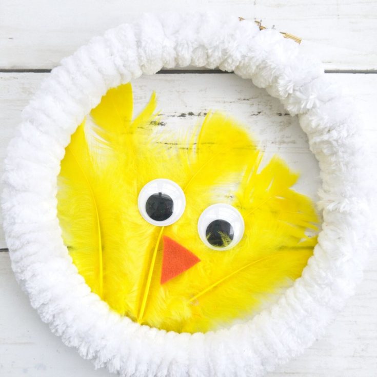 White wreath with yellow feather chicken in center