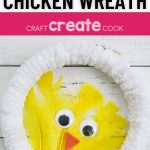 White wreath with yellow feather chicken in center