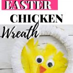 White wreath with yellow feather chicken in center