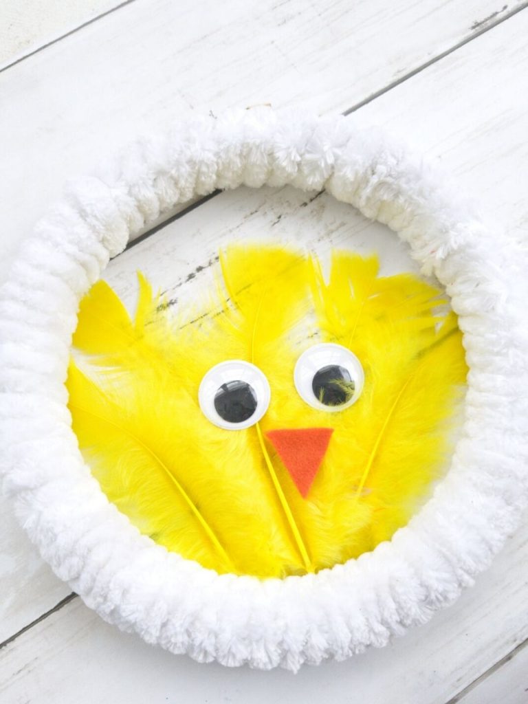 White wreath with yellow feather chicken in center