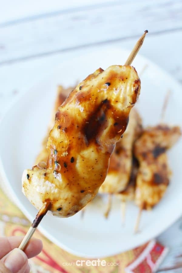 Chicken on skewer on plate