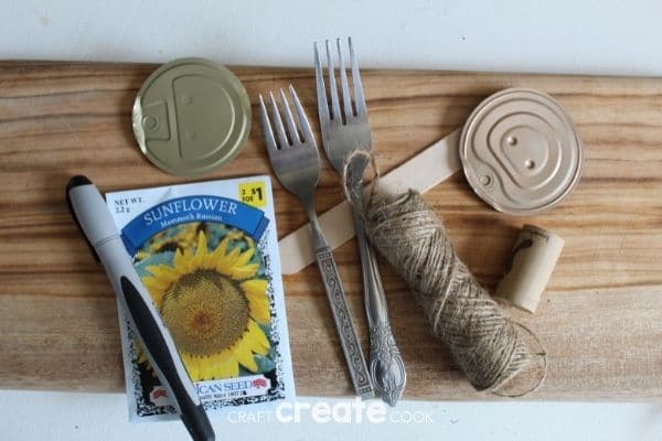 Supplies for garden markers on cutting board